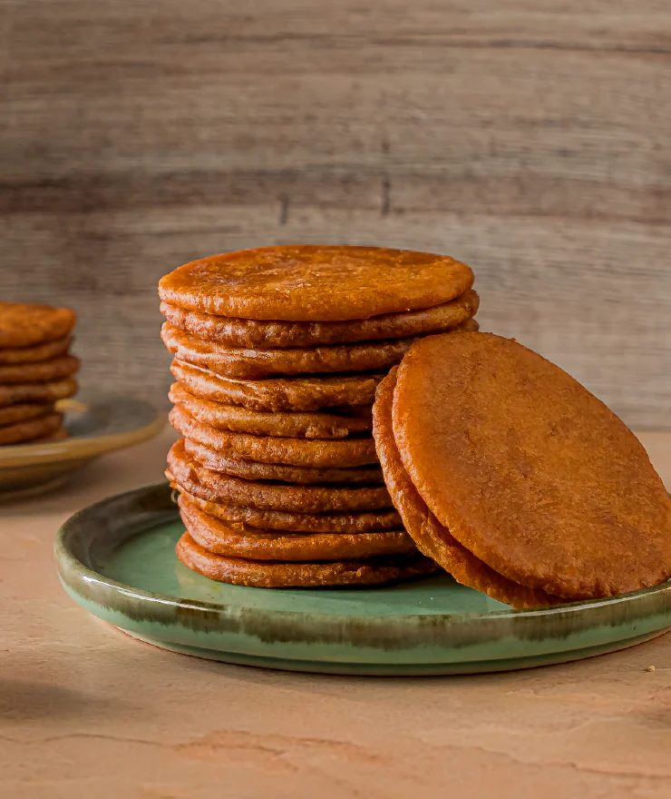 Ariselu — traditional Andhra rice flour sweets stacked on a plate